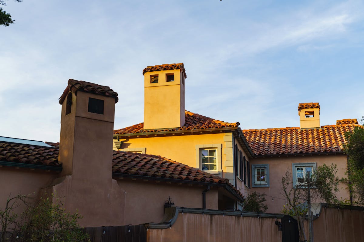 Mediterranean villa — stone, tile roof, courtyard shade
